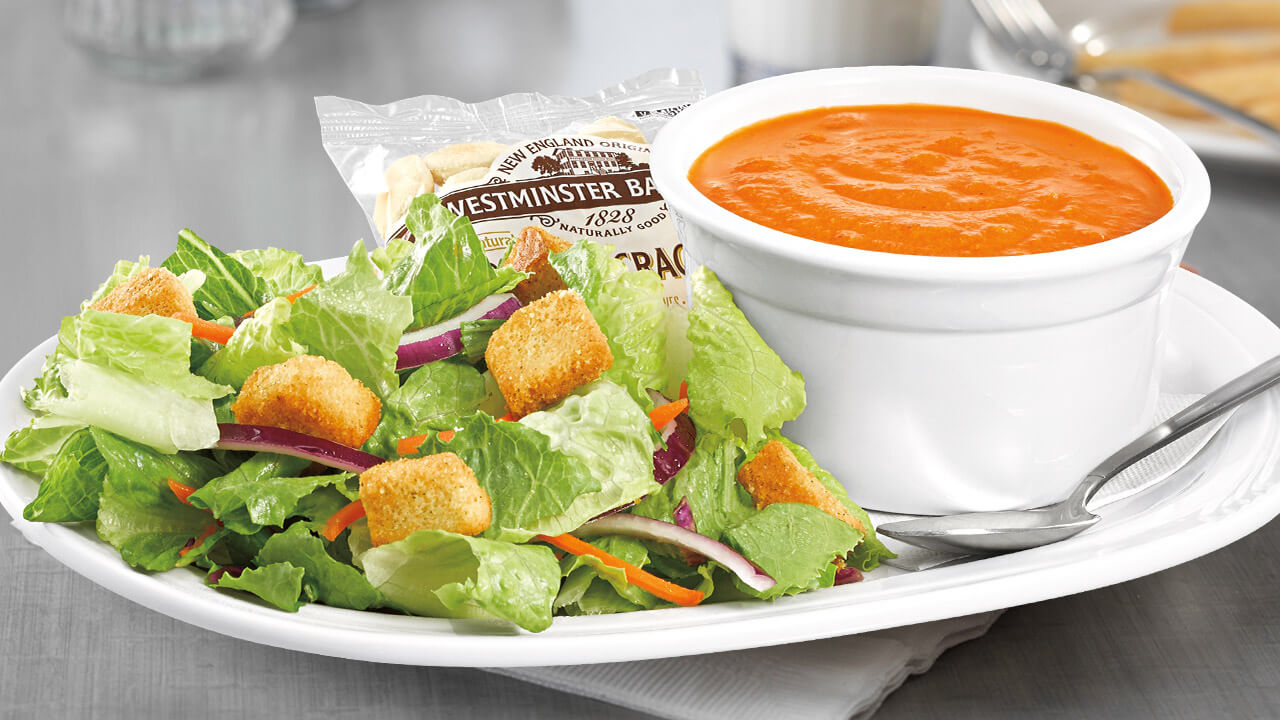 Thermos of soup with fresh side salad